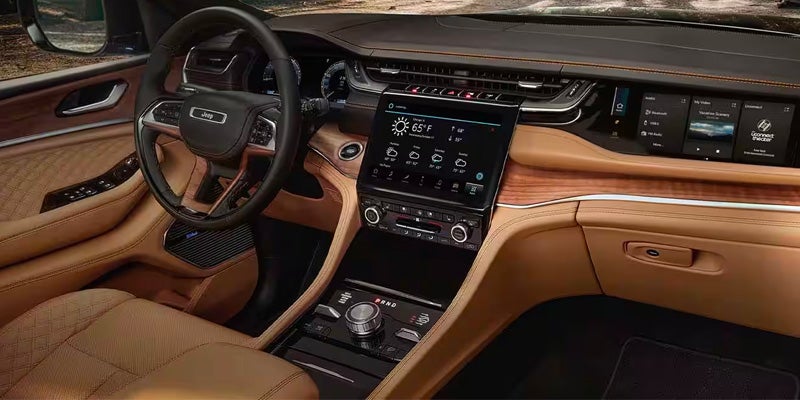Premium Jeep Grand Cherokee interior featuring a leather-wrapped steering wheel
