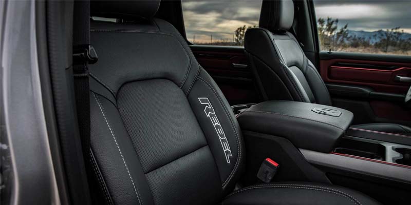 Close-up view of a vehicle’s front leather seat with contrast stitching